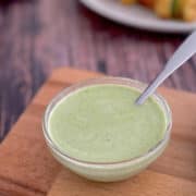 Indian mint sauce served in bowl with spoon.