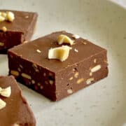 close up of chocolate peanut butter fudge on plate.