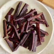 fresh air fryer purple sweet potato fries, served in plate.