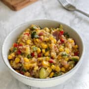 close up of Mediterranean quinoa salad in a bowl.
