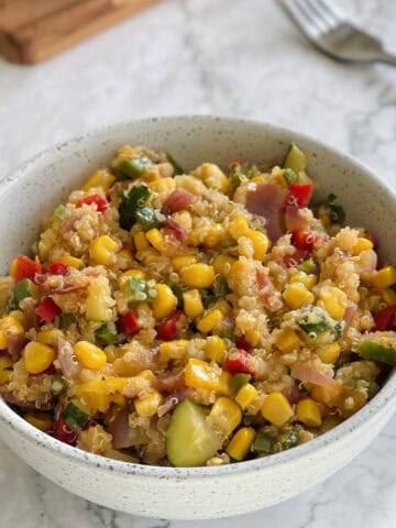 close up of Mediterranean quinoa salad in a bowl.