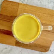 birds eye view of golden milk in cup.