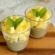 healthy and quick pineapple chia seed pudding with fresh mint served in glasses.