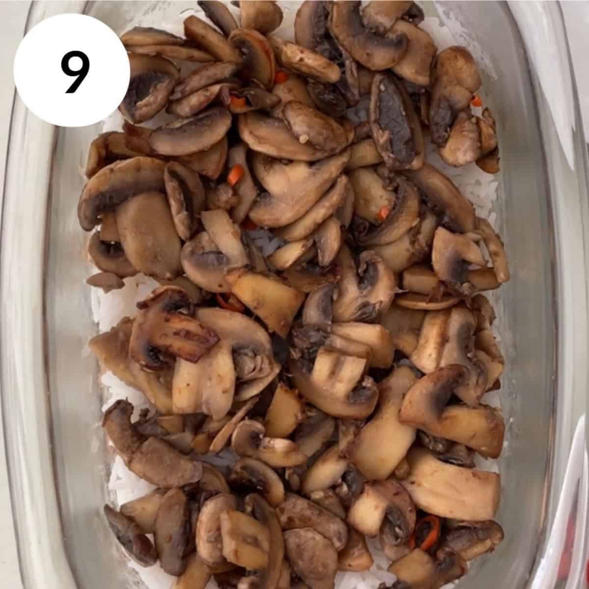 adding a layer of roasted garlic mushrooms on top of the rice.
