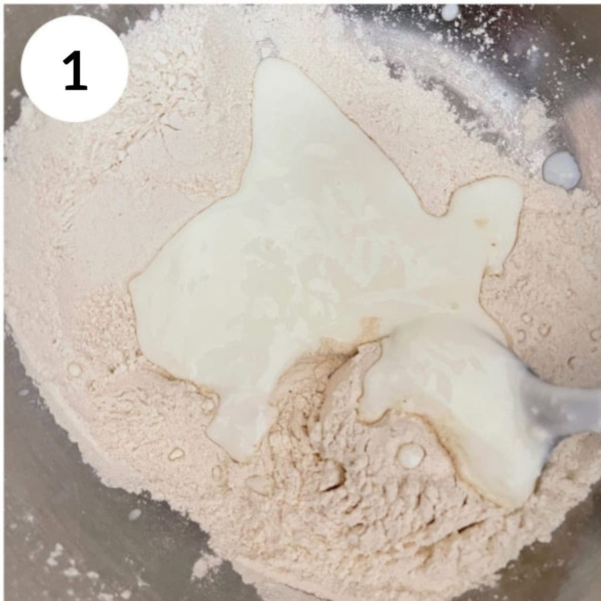 mixing dry ingredients and wet ingredients in a bowl to make the dough.