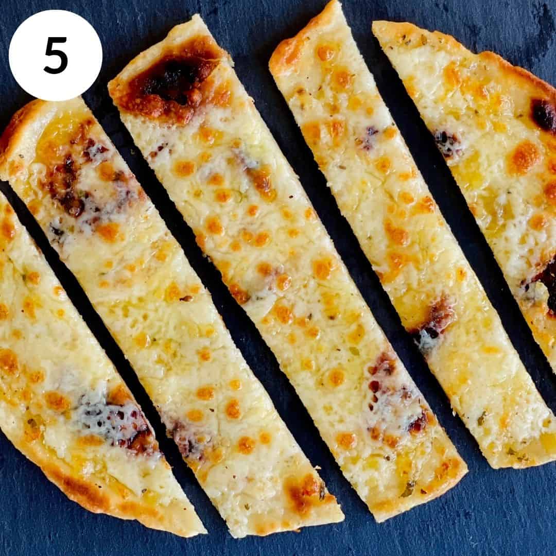 topping with garlic butter and cheese, then grilling to perfection.