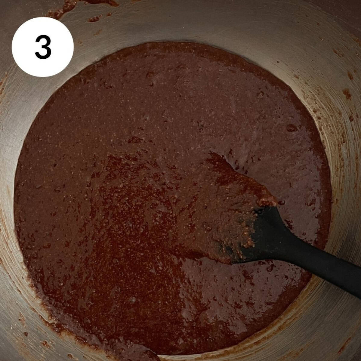mixing the dry and wet ingredients together.