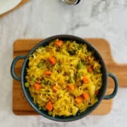 fresh cabbage curry in dark blue dish.