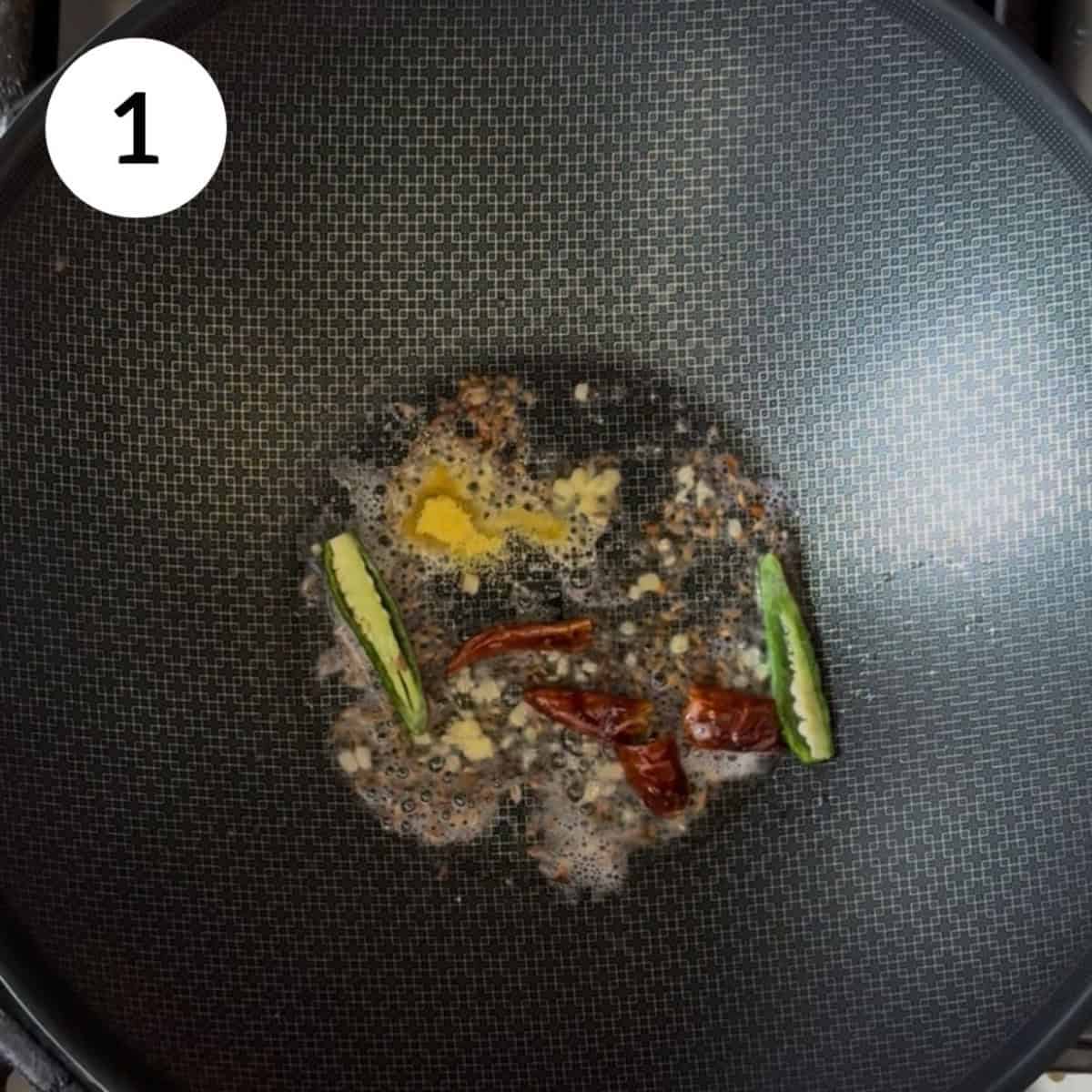 sautéing spices in pan.