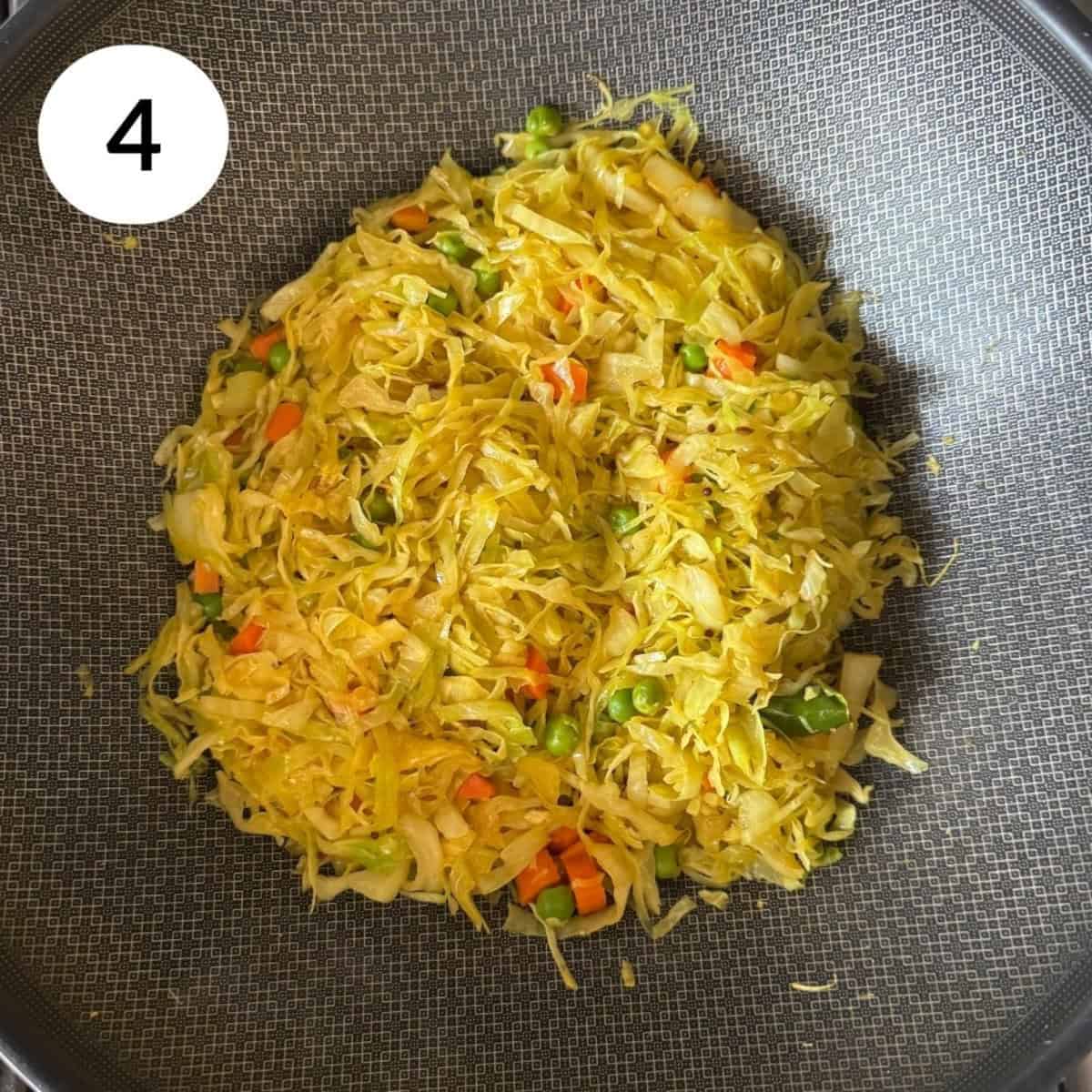 adding cabbage into the pan and cooking.
