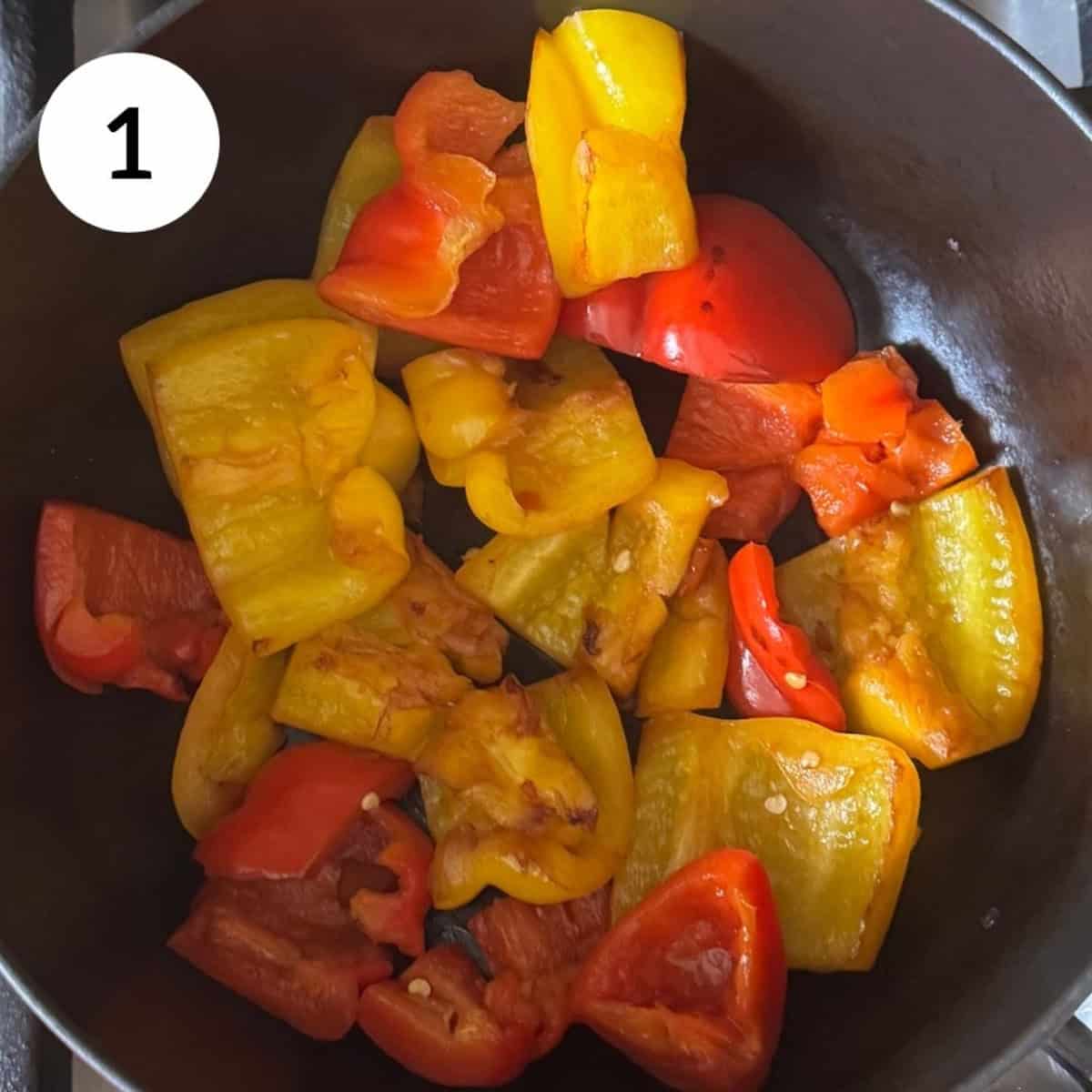 roasting red and yellow peppers in a pan.