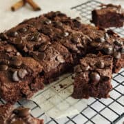 fudgy chocolate pumpkin brownies, cut into squares, on wire rack.
