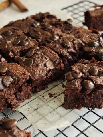 fudgy chocolate pumpkin brownies, cut into squares, on wire rack.
