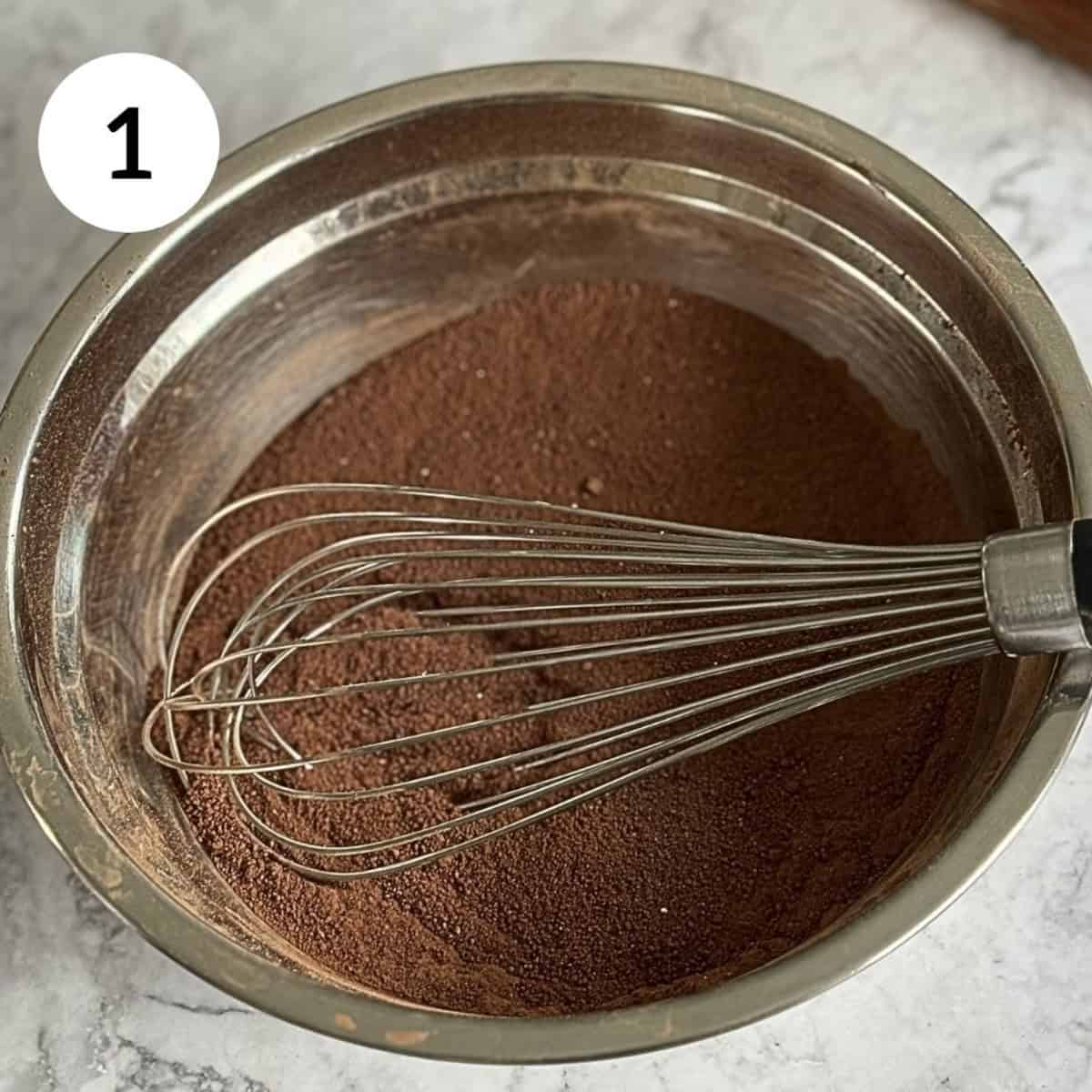 whisking dry ingredients in a bowl.