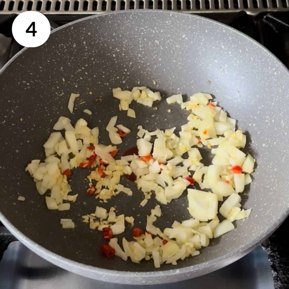 adding diced onions in the pan, softened and turning translucent.